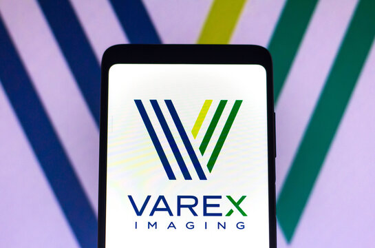 February 9, 2022, Brazil. In this photo illustration the Varex Imaging Corporation logo seen displayed on a smartphone and on the background.