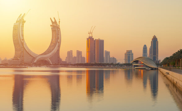 The beautiful newly developing city with many skyscrapers , shot during sunrise