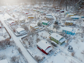 Aerial view of cottages covered with snow in Finland.