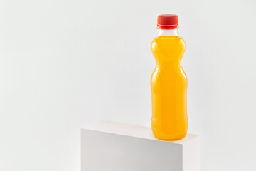 Orange fizzy drink in a plastic bottle isolated on white background