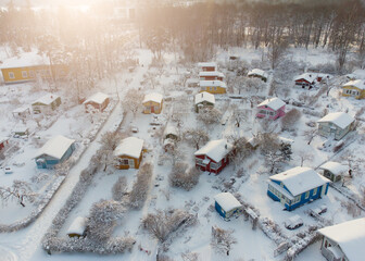 Aerial view of cottages covered with snow in Finland.