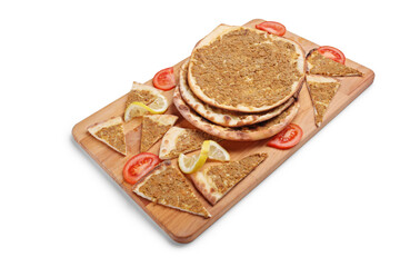 Slices of lahmajun on a wooden tray