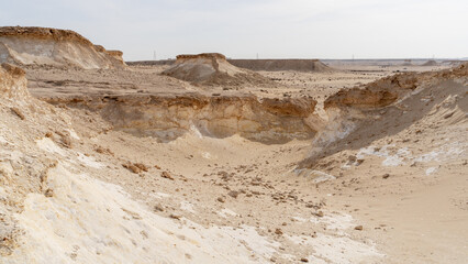 Zekreet desert natural landscape with with many limestone rocks.