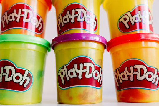 Valencia, spain - february 9, 2022: Play-doh brand plasticine cans.