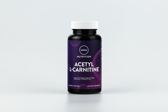 Acetyl L-Carnitine capsules in the jar. dietary supplement editorial photo