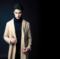 handsome asian fashion looking man posing in studio on black background, lifestyle modern people...