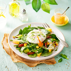 Vegetable Salad with Poached Egg, spinach and sausage, chorizo.