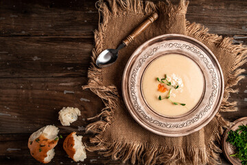 Obraz na płótnie Canvas A hearty bowl of cheese cream soup with chicken. homemade healthy organic diet fresh food meal dish soup lunch, top view