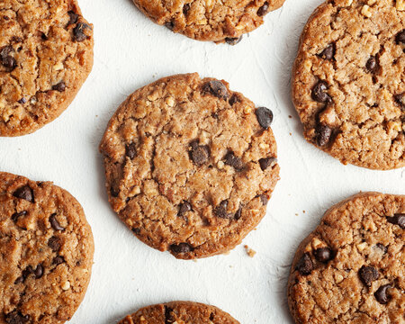 Tasty cookies on table against white background