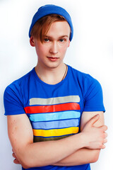 young handsome teenage hipster guy posing emotional, happy smiling against white background isolated, lifestyle people concept