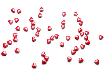 Valentine day isolated white background with red candies hearts. Concept of love, marriage, wedding, Valentine's day, passion. Top view.
