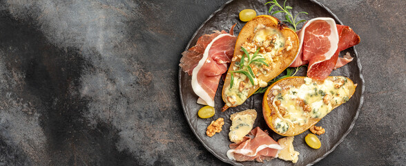 Pears baked with blue cheese, nuts and honey. French cuisine. Keto diet. Vegetarian lunch. banner, menu, recipe place for text, top view