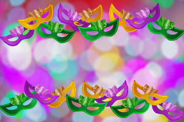 Fototapeta na wymiar Carnival masks on a blurred colored background. Symbol of carnival, holiday.