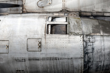full framed side view of a old rusty metallic big jet plane turbine reactor