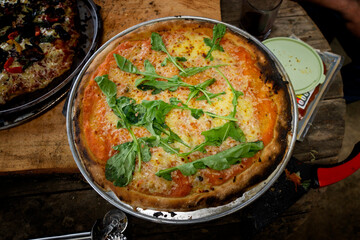 Vegetarian pizza made in a wood-fired clay oven