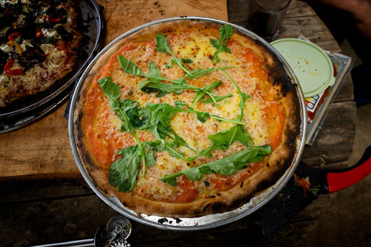 Vegetarian pizza made in a wood-fired clay oven