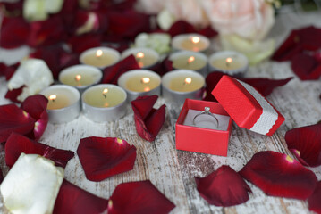 Ring in a box and rose petals
