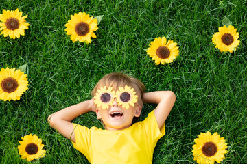 Happy child playing outdoor in spring park