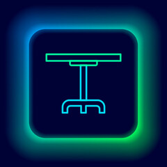 Glowing neon line Round table icon isolated on black background. Colorful outline concept. Vector