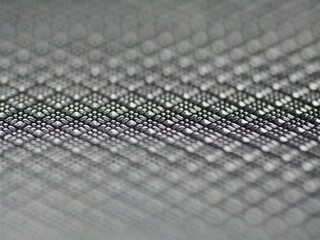 Abstract rhombus shape grey texture or background. Surface with ridges. Background with geometric shapes. Blurred edges