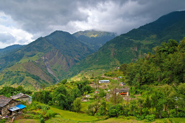 Mountain views of the Tatopani area during trekking around Annapurna (Annapurna Circuit), village with mountains in background. Himalaya, Nepal.