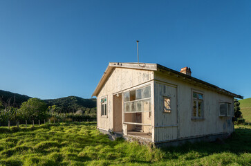 Fototapeta na wymiar Old Run Down House on Farmland in Northland New Zealand