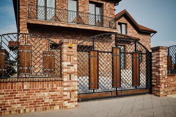Garage Door. A double garage with blue doors at the end of a driveway