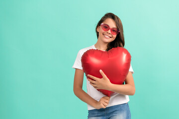 happy kid hold red heart party balloon for valentines day love symbol, copy space, valentines sale.