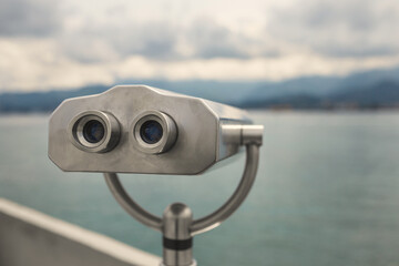 Binocular tube for viewing the panorama of the city - an observation deck for tourists