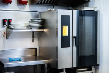 Professional baking oven in a restaurant kitchen prior to service. chef at work