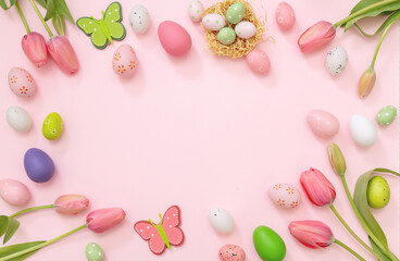 Fototapeta na wymiar Easter flat lay. Pastel color egg, tulip and season decoration pink background, overhead, space.