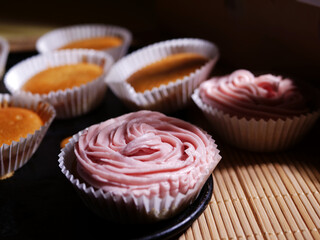 Home baked cupcake decorated with pink frosting 