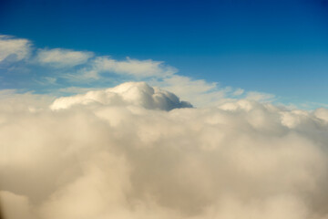 Fototapeta na wymiar clouds seen from inside an airplane through the window