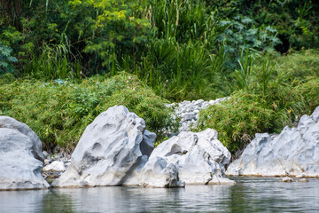Naklejka na ściany i meble view of rocks by the river