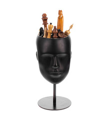 mannequin head with chess pieces