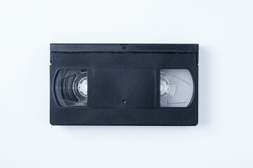 Obraz premium Black plastic video cassette on white background.
