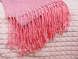 scarf and knitted materials on the bed