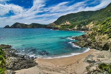 Deserted beach in Te Toroa Bay, along the Cape Brett Track, a hiking track on Cape Brett Peninsula, Bay of Islands, North Island, New Zealand.
