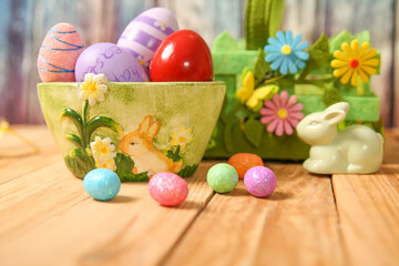 Fototapeta na wymiar Easter background. decoration for Easter with colorful eggs on a wooden table