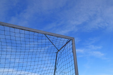 Football goal corner. Net against the blue sky. Copy space for extra text. Stockholm, Sweden, Europe.
