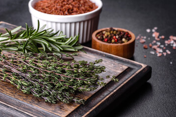 Bundle of fresh thyme grass on a wooden cutting board