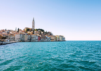 Beautiful Rovinj houses built right on the edge of the sea on the rocky peninsula above water