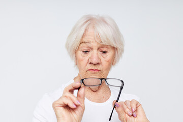 elderly woman vision problems with glasses isolated background