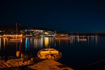 Popular luxury hotel behind the city port in the town of Rovinj, Croatia, photographed at night