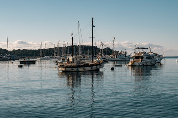Fototapeta premium Anchored fishing boat in the port of Rovinj, Croatia, photographed at sunset