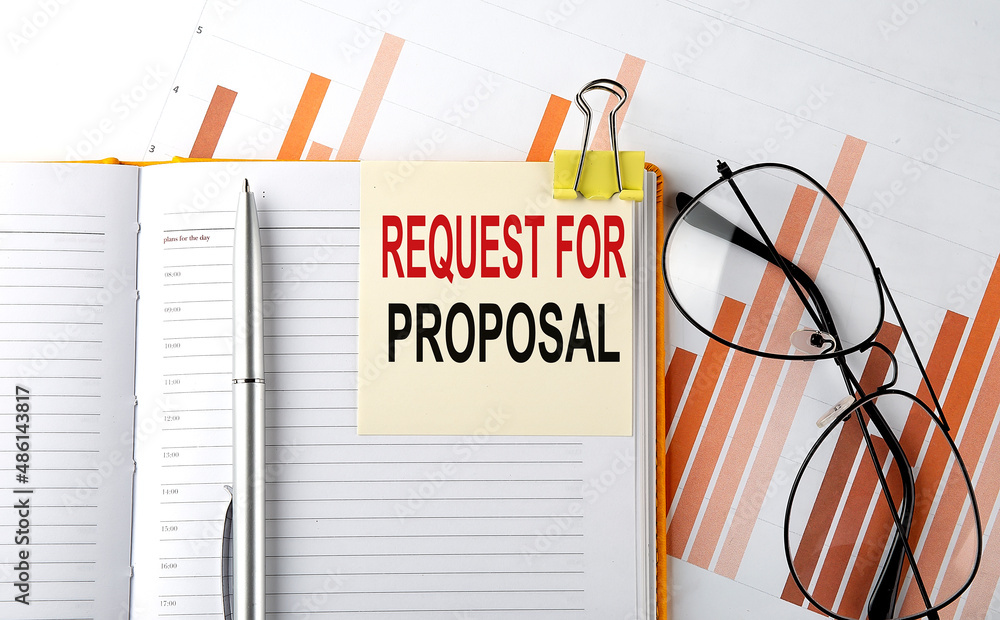 Poster text request for proposal on sticker on the notepad on diagram background