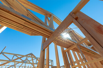Wood framing showing the roof under the blue sky