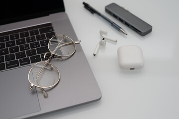 Work accessories and eyeglasses on white background