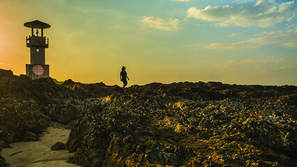 Khao Lak Light Beacon, beautiful sunset time at Nang Thong Beach , Khao Lak, Thailand. Tropical colorful sunset with cloudy sky . Patterns Texture of sand on the beach, Andaman sea Phang nga Thailand