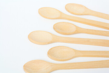 Wooden spoon on a white background. Wooden dishes. Isolate on a white background.